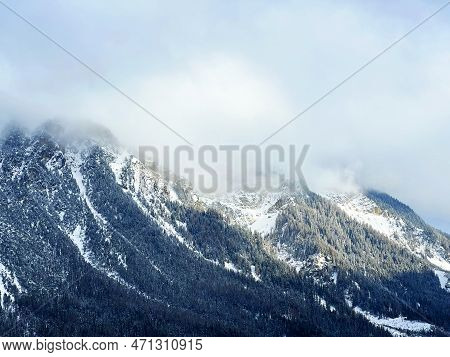 Beautiful Low Winter Clouds And Fog Condensation In The Swiss Alps Above The Tourist Resorts Of Valb