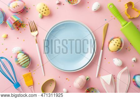 Easter Celebration Concept. Top View Photo Of Empty Blue Dishes Knife Fork Rolling Pin Whisk Colorfu