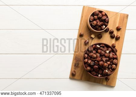 Wooden Bowl Full Of Hazelnuts On Table Background. Healthy Eating Concept. Super Foods.