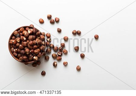Wooden Bowl Full Of Hazelnuts On Table Background. Healthy Eating Concept. Super Foods.