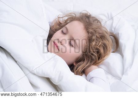 Little Kid Sleeps On Bed, Napping. Cute Child Sleeping. Comfortable Bed, Soft Pillow Orthopedic Matt