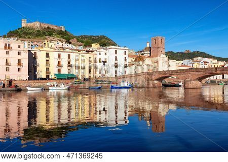 River With Homes And Apartments In Touristic Town. Bosa, Sardinia, Italy. Sunny Fall Season Day. Pan