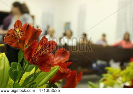 Church Ceremony Receives The Faithful With Decoration Of Floral Arrangements.