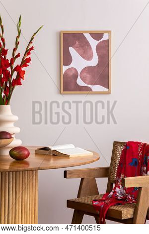 Warm And Cozy Interior Of Living Room Space With Mock Up Poster Frame, Wooden Table, Red Flowers, Ki