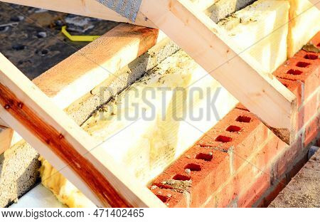 Insulating Walls Of New Build Houses By Placing Rock Wool Inside Wall Cavities As Part Of The Energy