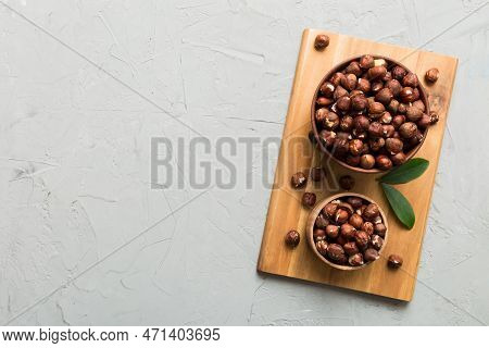 Wooden Bowl Full Of Hazelnuts On Table Background. Healthy Eating Concept. Super Foods.