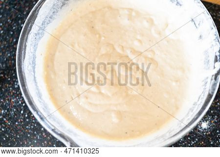 Pancake Batter In A Glass Mixing Bowl.