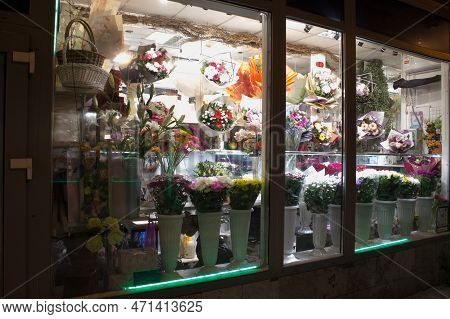 A Small Flower Shop With A Glowing Showcase