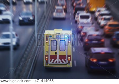 Ambulance Car Of Emergency Medical Service On Urban Road. Themes Rescue, Urgency And Health Care.