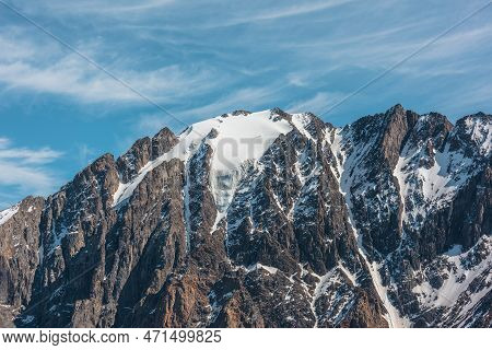 Scenic Alpine Landscape With Snowy Mountain Peak In Sunny Day. Awesome Landscape With Rocky Pinnacle