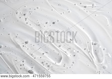 Clear Gel Serum Texture. Liquid Skincare Cream Background. Cosmetic Gel Product With Bubbles Close U