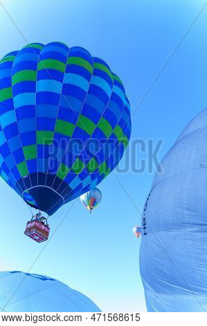 Balloons Rising Into The Air. Taken At 42nd International Balloon Festival In Chateau D'oex In Janua