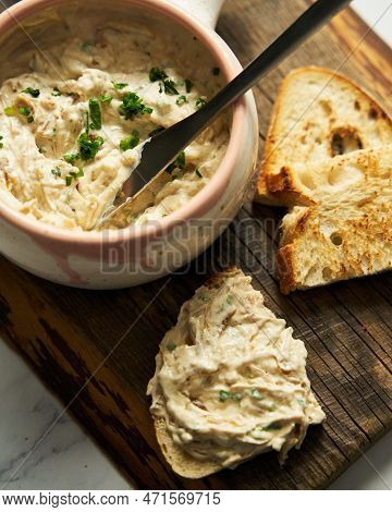 Sour Cream, Yogurt And Caramelized Onion Spread Dip In The Bowl On Wood Board. Bread Pieces Are Near