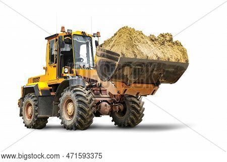 A Large Front Loader Transports Sand In A Bucket At A Construction Site. Transportation Of Bulk Mate