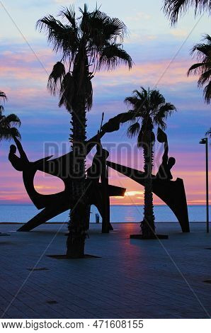 Barcelona, Spain-january 02,2016:scenic Morning Landscape. High Palm Trees And Modern Sculpture Agai