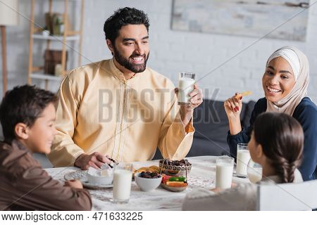 Cheerful Muslim Family Having Suhur Breakfast During Ramadan.