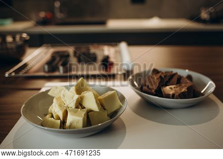 Beautiful Young Chef Decorating Delicious Dessert  In Modern Kittchen