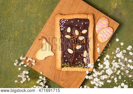 Polish Easter Sweet Mazurek Made Of Shortbread Dough Stuffed With Chocolate, Decorated With Nuts, Dr