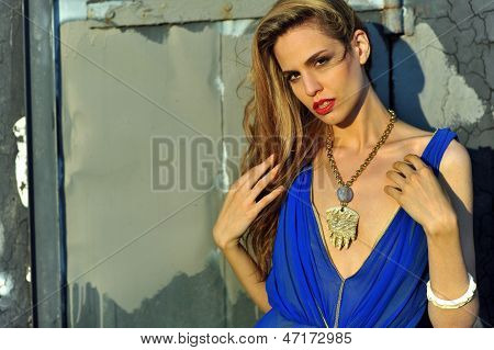 Closeup portrait of fashion model with full hair and red lips posing sexy