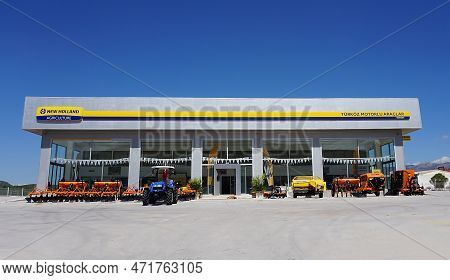Araclar, Turkey - September 16, 2022: New Holland Agriculture Logo In The Dealership Store Against A