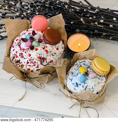 Two Beautiful Eastercakes Decorated With Colored Chocolate Eggs And Macaroons