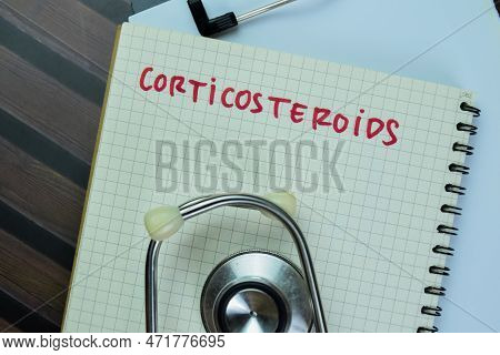 Concept Of Corticosteroids Write On Book Isolated On Wooden Table.