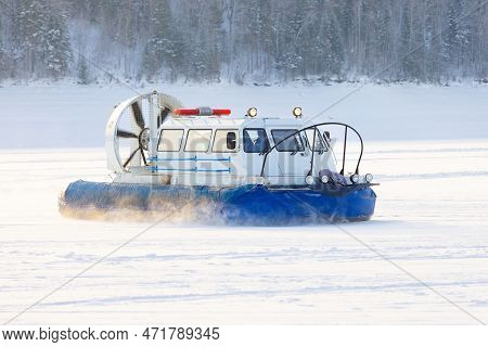 Hovercraft Transport On A Winter Snow-covered Lake In Siberia, Russia. Khivus Boat Hovercraft Rides 