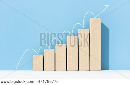 Growth, Increasing Business, Success Process Concept. Increasing Bar Graph With Arrow Going Up On Bl