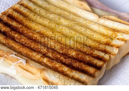 Grilled Ham And Cheese. Sandwich With Cheese And Ham On The Grill.
