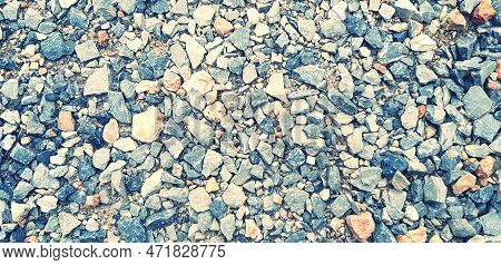 Pattern Of Small Gravel, Rock Or Stone On The Ground For Background In Blue Vintage Color Tone. Hard