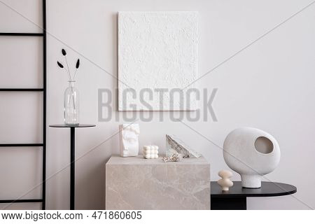 Creative Composition Of Cozy And Stylish Living Room With Mock Up Paintings, Marble Cube, Side Table