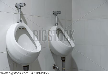 Closeup Old Urinals (chamber Pot) In Toilet With Soft-focus And Over Light In The Background