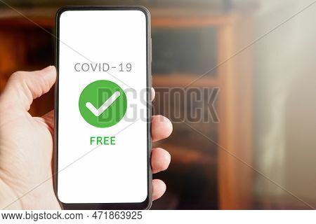 Male Hand Holding Mobile Phone With Text 