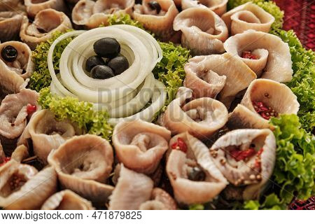 Marinated Herring Rolls With Vegetable. A Composition With Marinated Herring Rolls And Vegetables. H