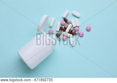 Different Antidepressants And Medical Bottle On Light Blue Background, Flat Lay