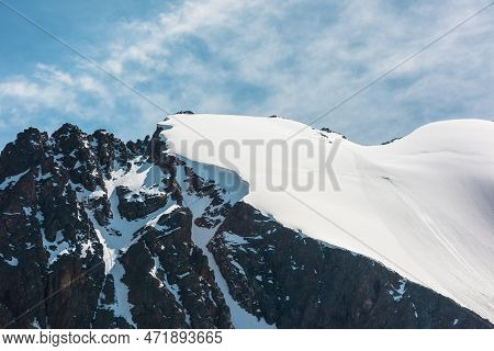 Minimalist Alpine Landscape With Snow-covered Mountain Top And Sharp Rocks In Sunlight. Simple Minim