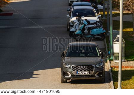 Side, Turkey -january 30, 2022:   Brown Audi Q2  Is Parked  On The Street On A Warm  Day Against The