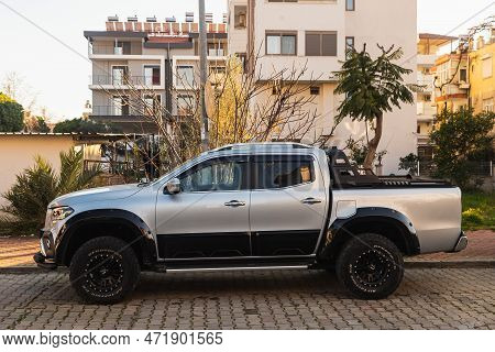 Side, Turkey - February 13 2022:  White Mercedes-benz  X-class   Is Parked  On The Street On A Warm 