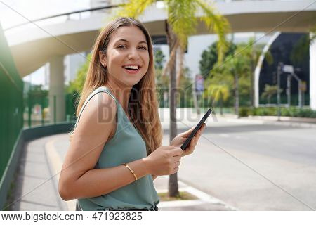 Young Female Entrepreneur Walking In Modern Natural City In The Morning