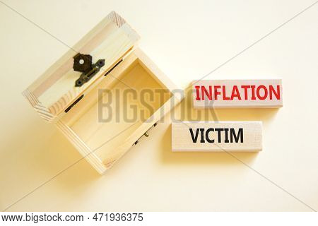 Inflation Victim Symbol. Concept Words Inflation Victim On Wooden Block. Beautiful White Table White
