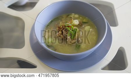 Oxtail Soup Is A Soup Made With Beef Tails Served In A Table.