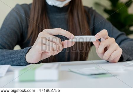 Pandemic Of Disease, Asian Young Woman, Girl Hand Holding Atk, Antigen Kit Self Test. Introducing De