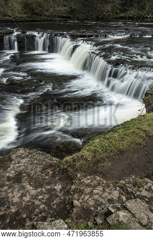 Beautiful Peaceful Landscape Image Of Aysgarth Falls In Yorkshire Dales In England During Winter Mor