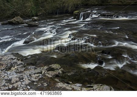 Beautiful Peaceful Landscape Image Of Aysgarth Falls In Yorkshire Dales In England During Winter Mor