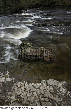 Beautiful Peaceful Landscape Image Of Aysgarth Falls In Yorkshire Dales In England During Winter Mor