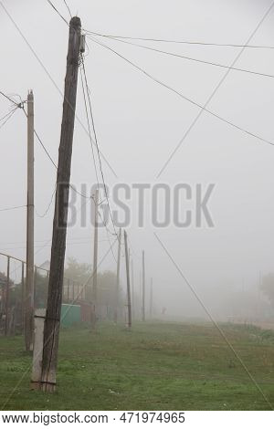 A Foggy Countryside Old Street With Retro Power Lines And Wood Telephone Poles, Green Grass,minimali