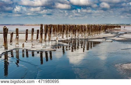 Salt Crystals On Wooden Pillars Of An Old 18Th Century Salt Industry. The Ecological Problem Is Drou