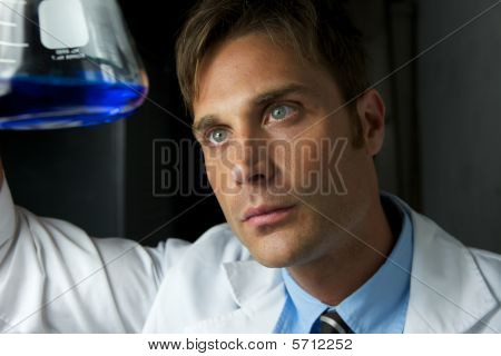 Young Scientist Performing Experiment