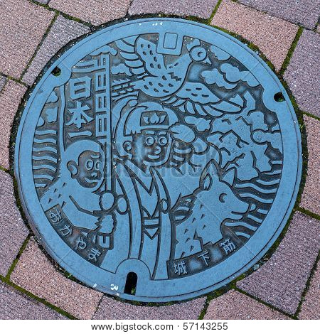 Okayama, Japan - November 17 2013: Momotaro Character On A Manhole Cover, Momotaro Is A Symbol Of Ok