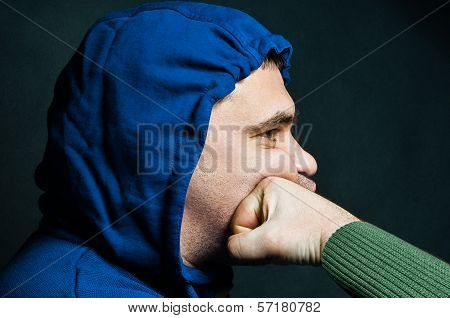Portrait of a man being shocked in the face in a fist fight